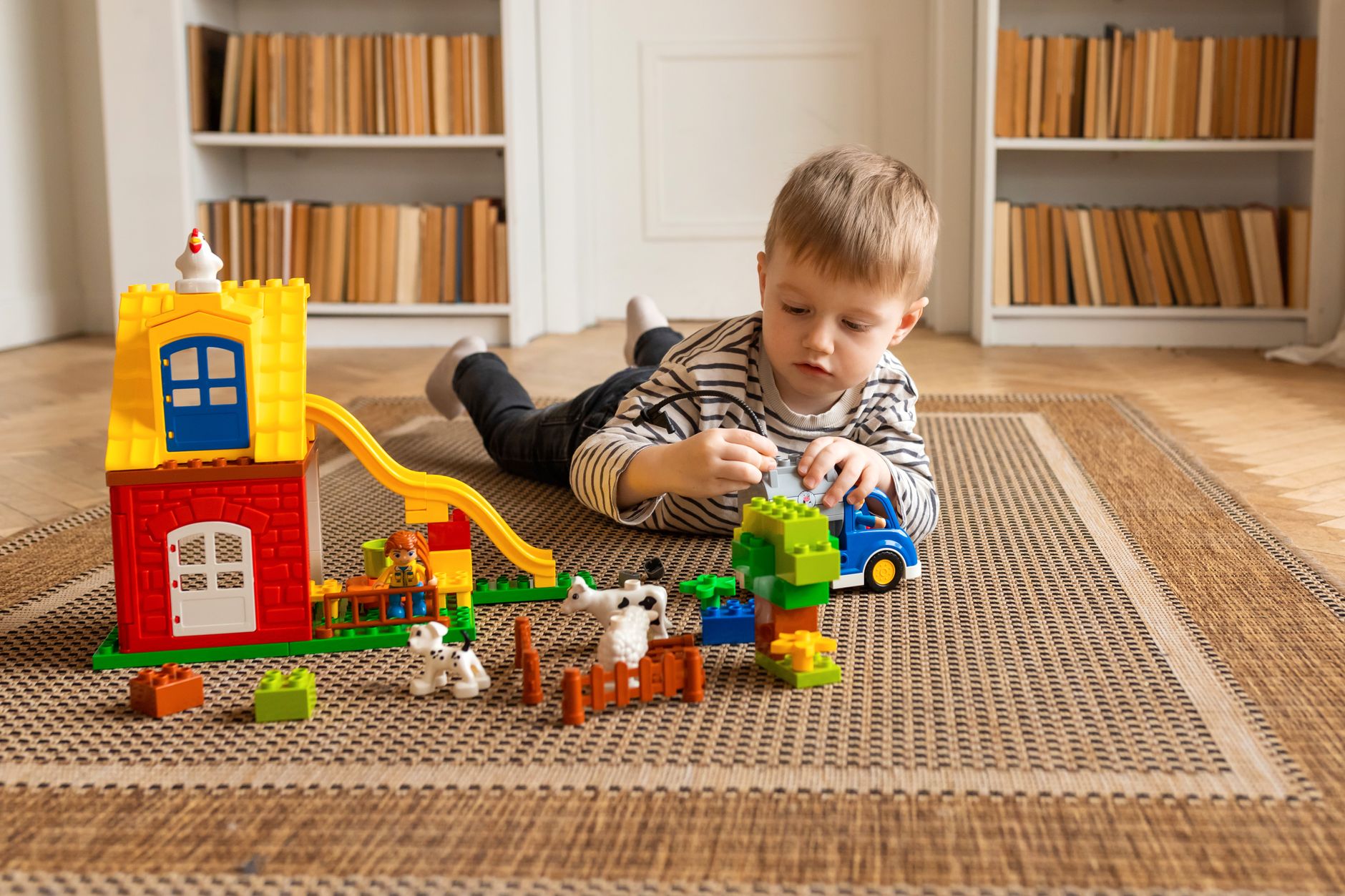 Child engaged in a colorful learning activity
